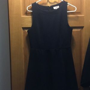 Black with purple polka dot fit and flare dress.